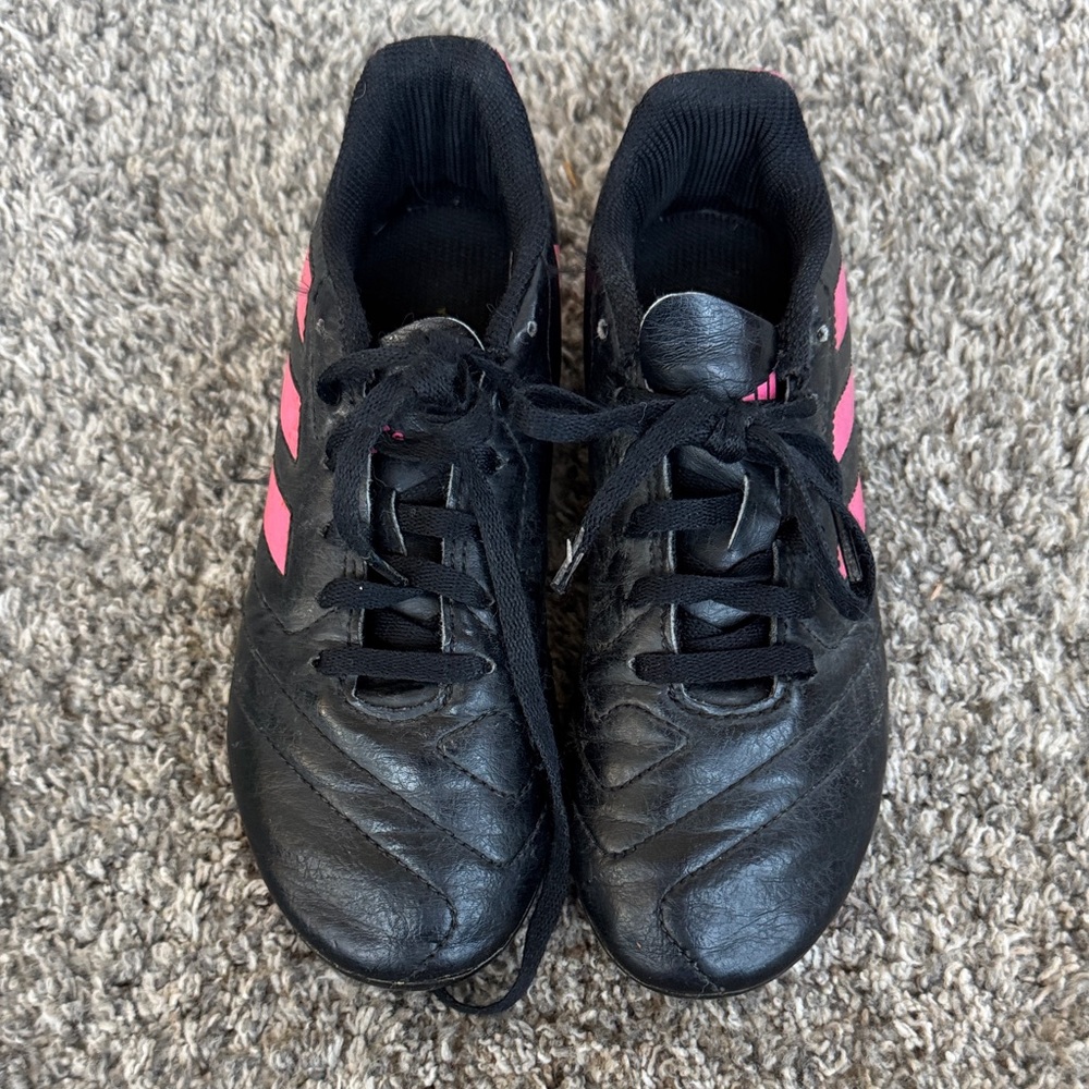 Adidas Kids Black Cleats with Pink Stripes